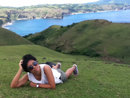 Vira trying to hide her exhaustion after climbing the hill in Batanes, Philippines